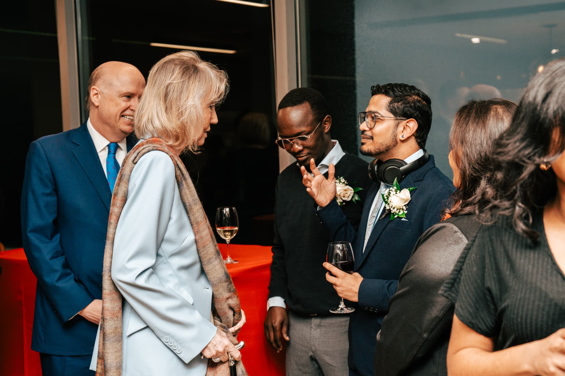Satvik Sinha in conversation with guests at a King's Trust reception